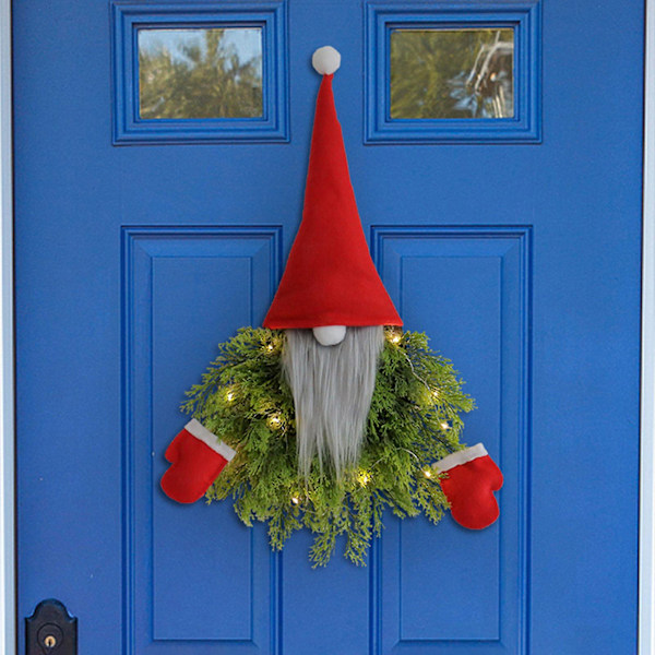 Julkrans med docka att hänga, festlig dekoration, ansiktslös docka, krans för veranda, rum, vägg, fönster, dörr