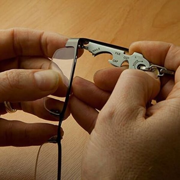 Monitoiminen avaimenperä 8-in-1, sisältää pullonavaajan, ruuvimeisselin ja muita Keytool/NC-työkaluja
