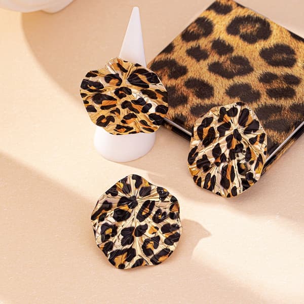 Stilfulde øreringe og ringe i legering med leoparddesign til festartikler