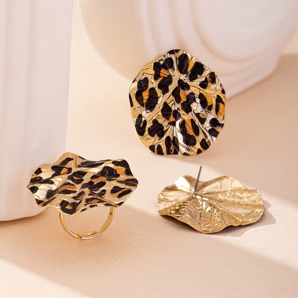 Stilfulde øreringe og ringe i legering med leoparddesign til festartikler