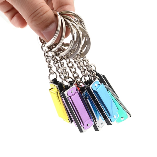 Färgglad munspel Nyckelring Munspel Mini 8 Tone 4 hål för nyckelring för nyckelring 3,6 x 1,2 x 0,8 cm för barnleksak Pink