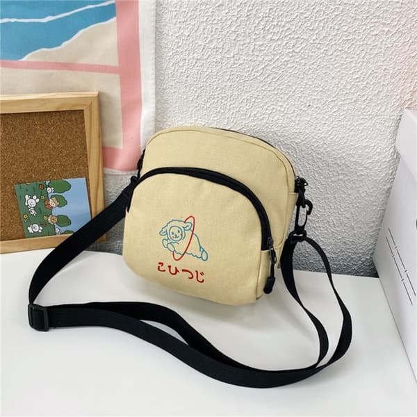 Axelväska i canvas med tecknat motiv KAMEL Camel
