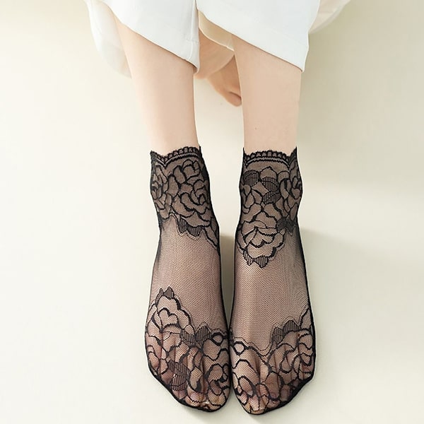 1pari läpinäkyvät sukat Invisible Ruffle Sock MUSTA BLACK