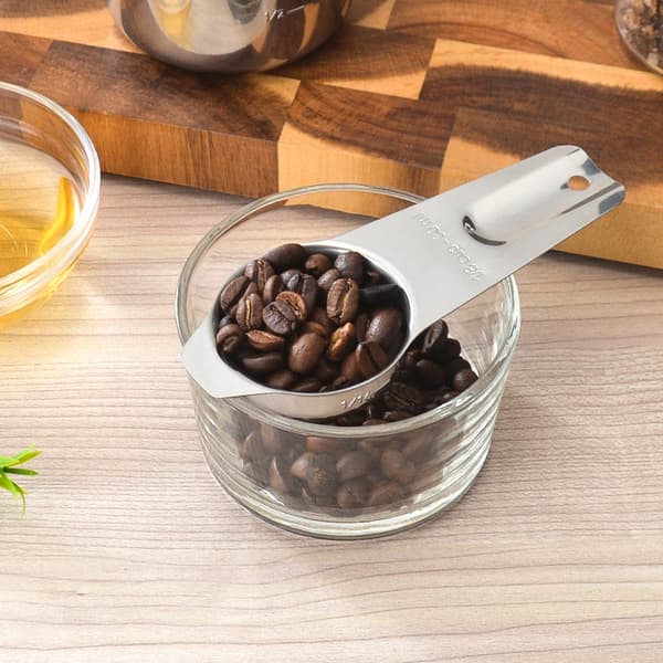 Sæt med syv måleskeer i rustfrit stål til madlavning af kaffebønner. (DB)