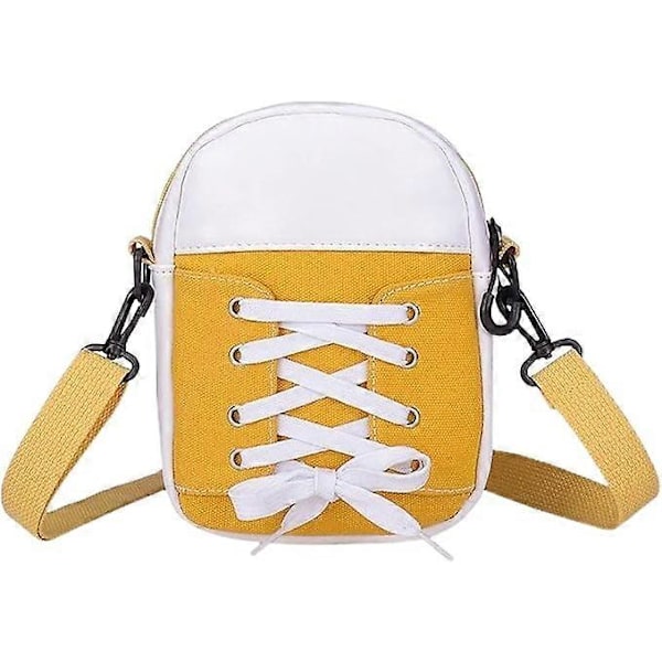 Ny statement väska i canvas med spetsdetaljer och färgblock, en stilren och mångsidig crossbody-väska som bärs över ena axeln