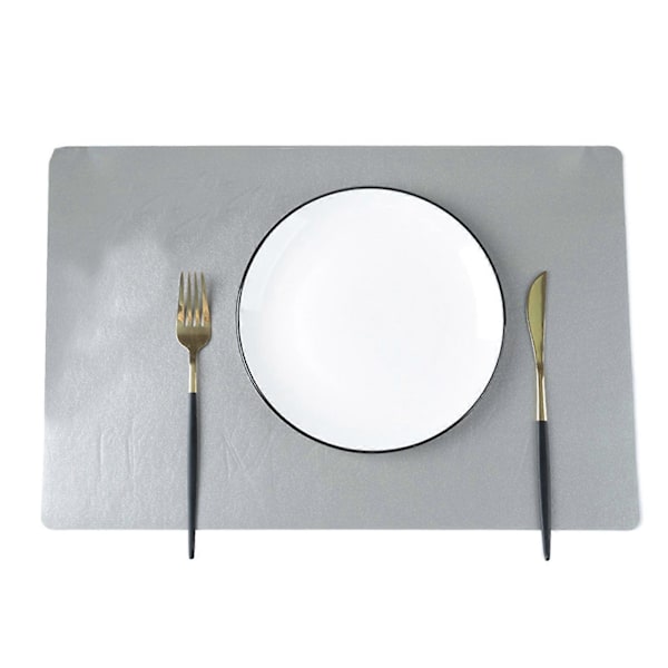 Faux Läder Underlägg Värmebeständiga Halksäkra Bordstabletter Fläcktåliga Återanvändbara Rektangulära Design Underlägg för Hemkök Dekoration Matbord Silver