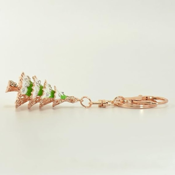 1 lila julgransnyckelring med roséguld-färgad charmhänge med splittring