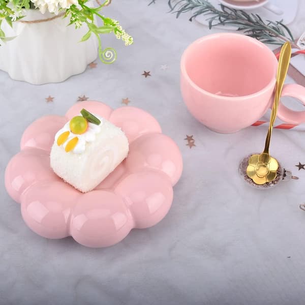 Keramisk kaffemugg, molnformad kaffemugg och fatset (rosa).