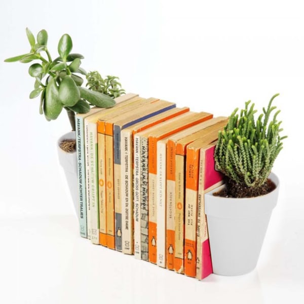 Bokstöd med dekorativ konstgjord växtkruka bokhylla display