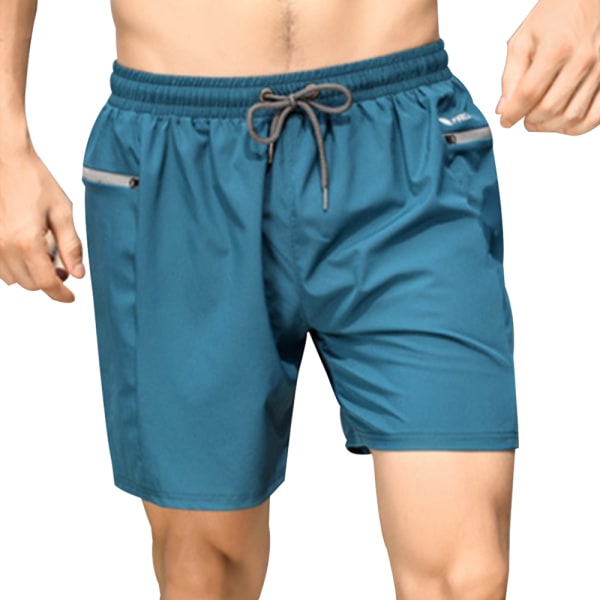 Strandbyxor i varma våren för män, snabbtorkande lösa shorts