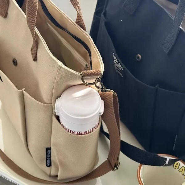 Urban Minimalistisk Kvinnlig Student Stor Kapacitet Pendla Horisontell Canvas Enkel Axel Diagonal Cross Portable Tote Bage Svart