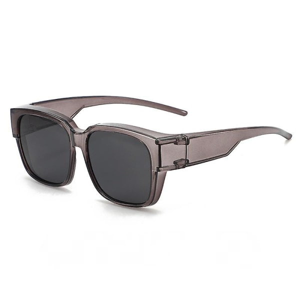 Ett par polariserade solglasögon för bilkörning och fiske Uv400 skydd (transparent grå ram svart grå lakan)