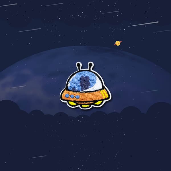 Set med 18 datorbroderade planettecknade astronautbroderier