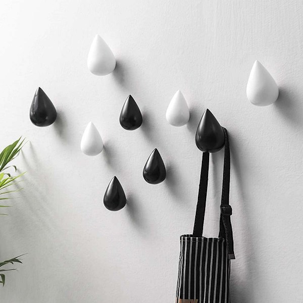 Kreativt set med 4 droppformade klädkrokar för väggmontering, modern design