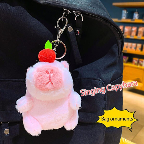 Laulava Capybara plyysiavainperä - luova musiikkipehmolelu riipus, reppukoriste Rosa