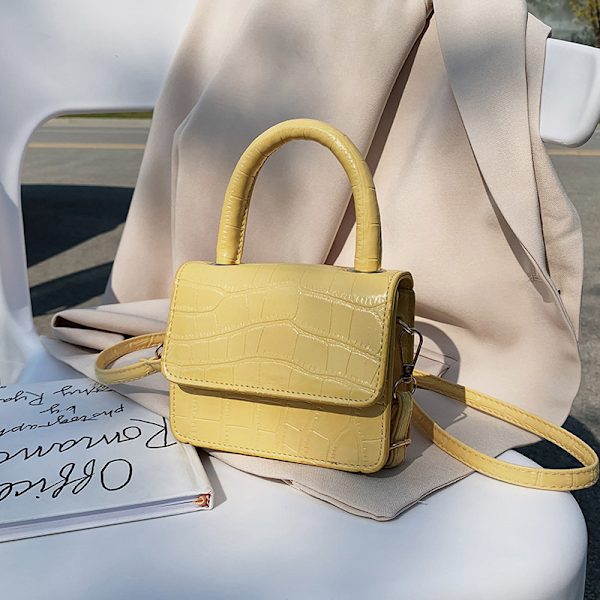 Uusi internet-tähti samassa tyylissä kivikuvioinen olkalaukku naisten käsilaukku korealainen tyyli crossbody flip monipuolinen käsilaukku tote-laukku Keltainen
