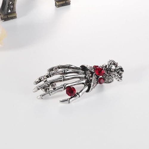 Dödskalleformad handbrosch, punk chic-stil, prydd med strass och tillverkad av legering. Mångsidig accessoar för kläder och väskor. (JYD)