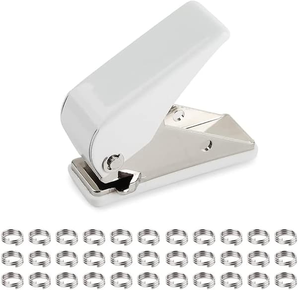 Hullstanse med 100 elastiske skiver. Hullstanse for boring gjennom finner og innsetting av elastiske ringer.[YJD]