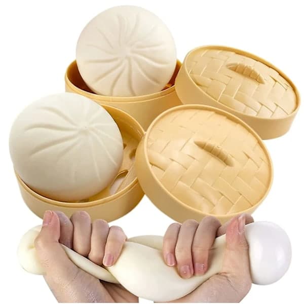 To nuttede dumpling-formede stressaflastningslegetøj; dumpling-formede stressbolde, bolle-formede, til stressaflastning og afslapning.