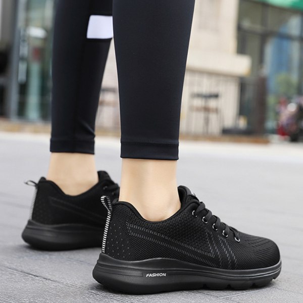 Platta sneakers för kvinnor med rund tå Black 38