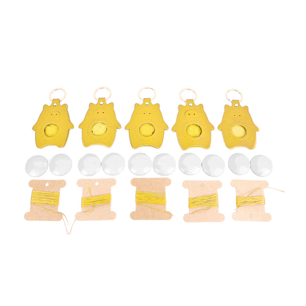 5-deligt DIY-kit för lädernyckelringar - Söta tecknade spargrisar i blank form för pyssel - Lysande gul läderarbetsutrustning 5 Sets Yellow