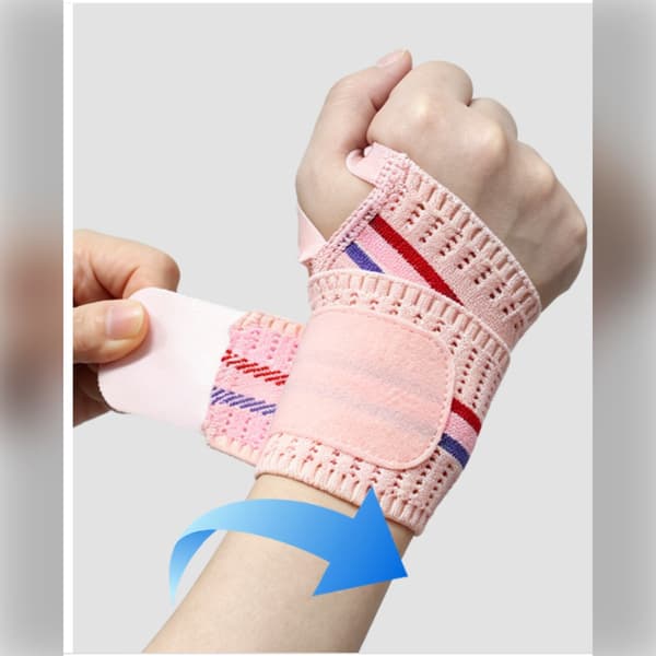 Handledsomslag i nylon för tyngdlyftning med tumögla och justerbar kompression Pink Pink