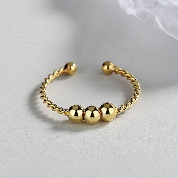 Justerbar antistressring med roterbara pärlor Guld