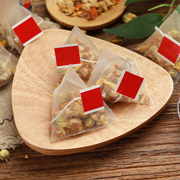 15 förpackningar Osmanthus tepulver malningsprocess Osmanthus päron örtte Triangulärt förpackning te för hemmakontor