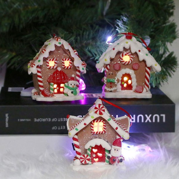 Julscen byhus, led upplysta julbyggnader, julglödande litet hus