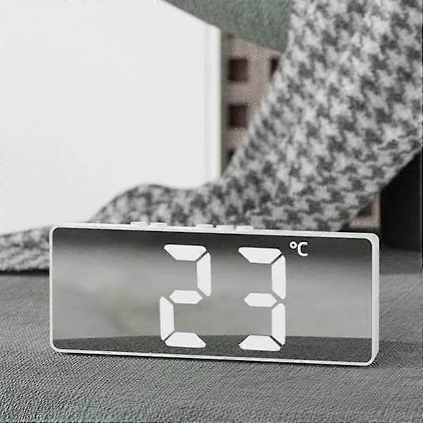 Digital (battery-powered or USB-powered) desk clock with snooze and night modes.