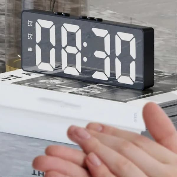 Digital (battery-powered or USB-powered) desk clock with snooze and night modes.