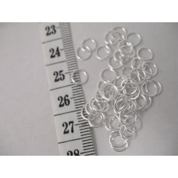 40 gr. (drygt 900 st.) Nickelfria Silverpläterade motringar6 mm. Silver