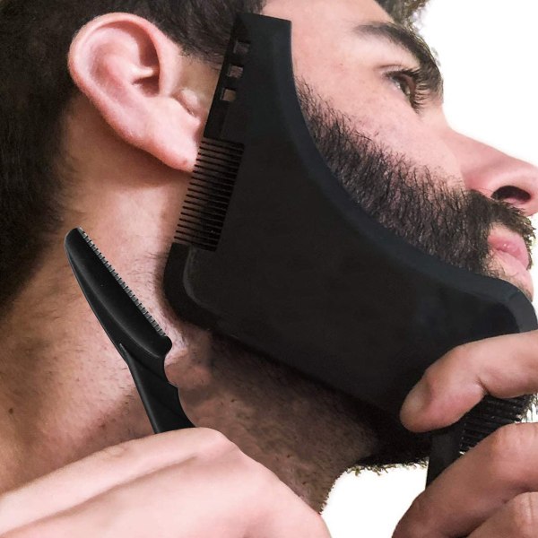 Et svart barberverktøy i ett stykke eller gjennomsiktig mal for trimmi