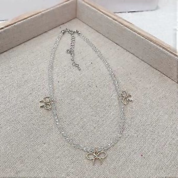 Tyylikäs rusettikuvioinen kaulakoru Muoti Kristallikoristeinen choker-kaulakoru Yksinkertainen kauluskaulakoru Solisluuketjun koru Pinkki Pink