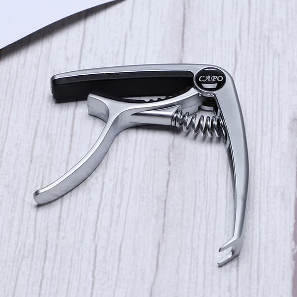 [BQ]Gitarrcapo av sinklegering (Sølv), Metallcapo, Ukuleleklemme, Plekter, Capo Gitartilbehør