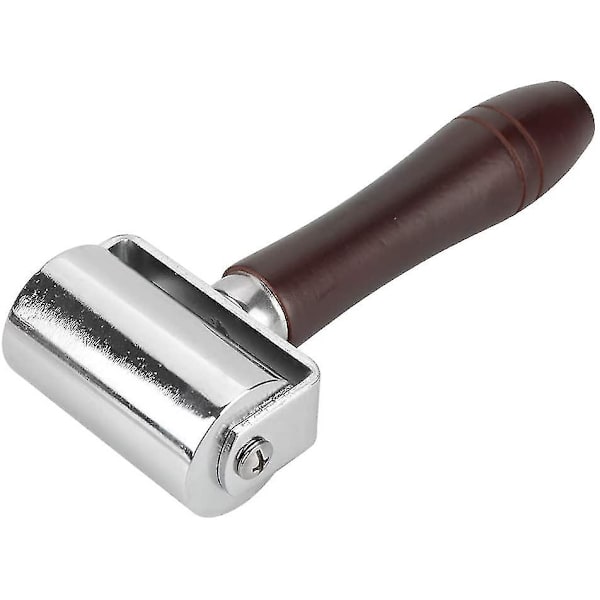 Hiiliteräksinen nahkapuristusrulla