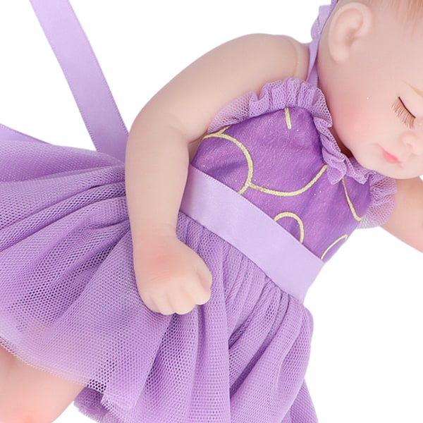 10 tum Nyfödd Reborn Docka Mjuk Silikon Verklighetstrogen Sovande Babydocka Leksak med Vacker Klänning Lila Kläder