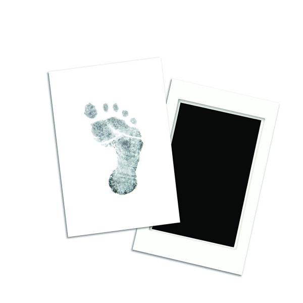 Nyfödd baby handavtryck eller fotavtryck bläckdyna, svart