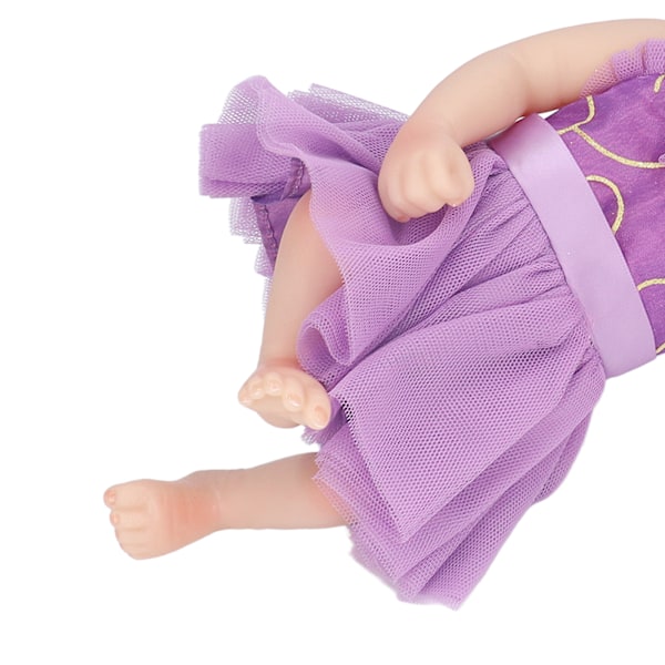 10 tum Nyfödd Reborn Docka Mjuk Silikon Verklighetstrogen Sovande Babydocka Leksak med Vacker Klänning Lila Kläder