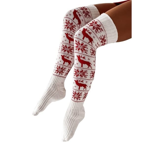 En vacker julklapp stickad strumpa för en kvinna eller flicka över knäet