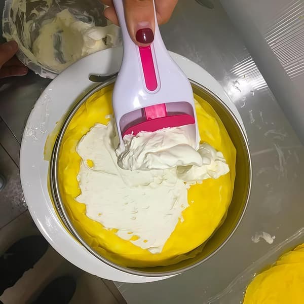 A cookie dough dispenser with a push button for portioning dough; a dough dispenser for home use and baking tools. [Ho]