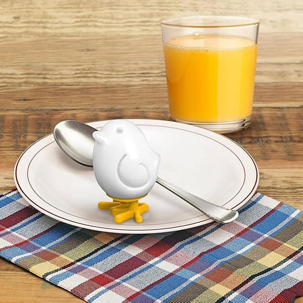 A set of two yellow chicken-shaped egg molds for boiled eggs - cute and creative egg shapers, a fun breakfast aid.