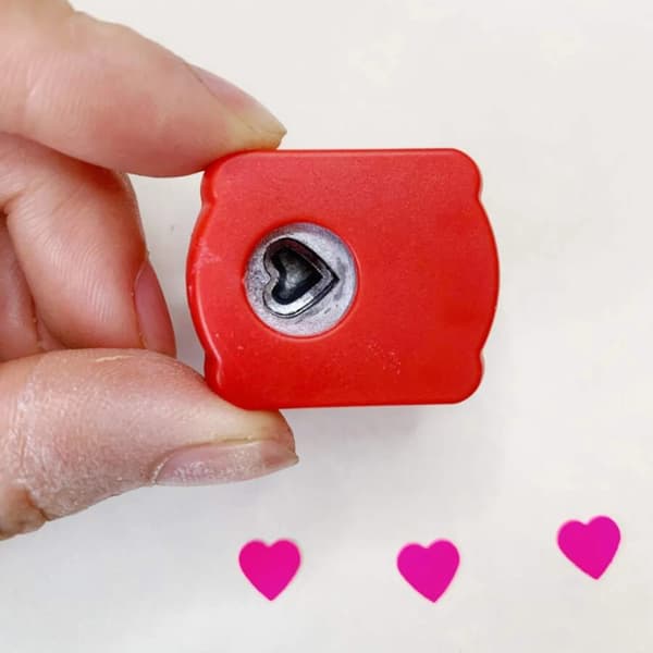 A heart-shaped hole punch, suitable for weddings, scrapbooking, card making, etc.