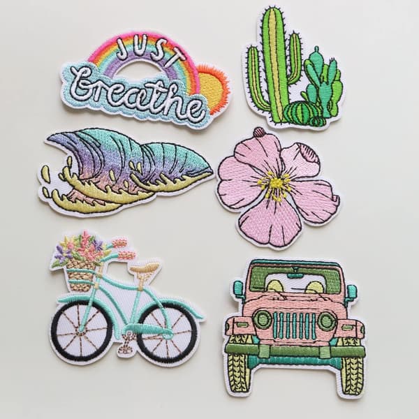 18 assorterede strygeapplikationer med broderede blomster til Cl
