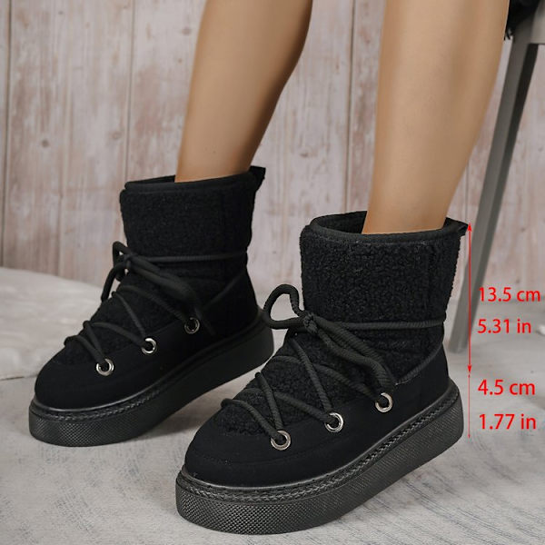 Stora, tjocka snöboots med korsband, förstärkt till mitten av vaden, inte över knät. Varma damboots. Black 43