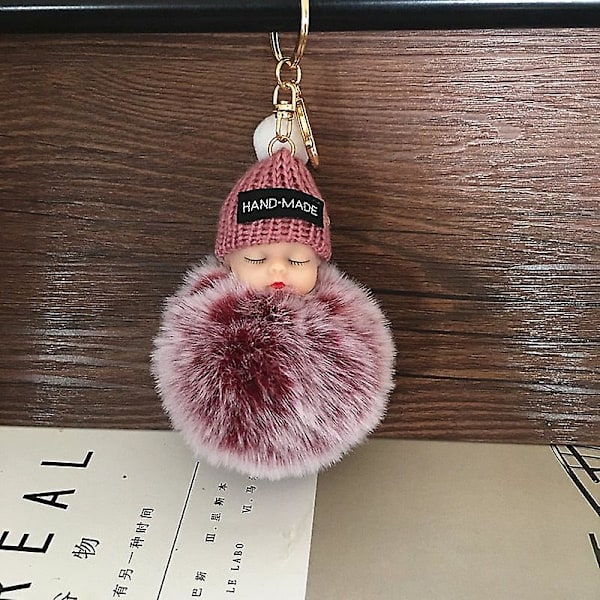 Sovende babydukke nøglering H