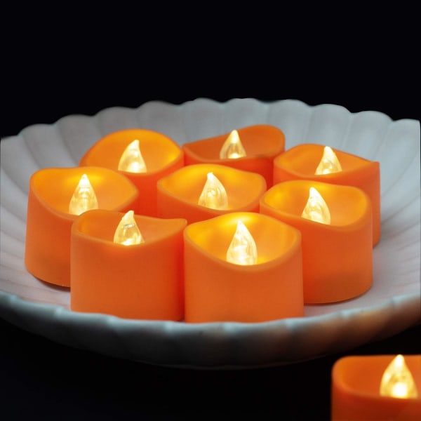 Halloween 12-pakkaus oransseja tealight-kynttilöitä, paristokäyttöisiä LED-teavaloja, pienet avoimet kurpitsat