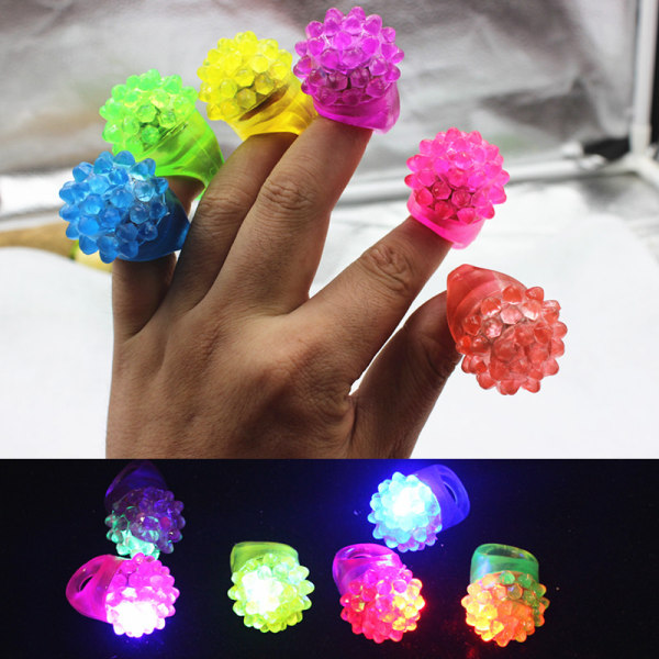 Blinkande färgglada LED Light Up Bumpy Jelly Rubber Rings Fing