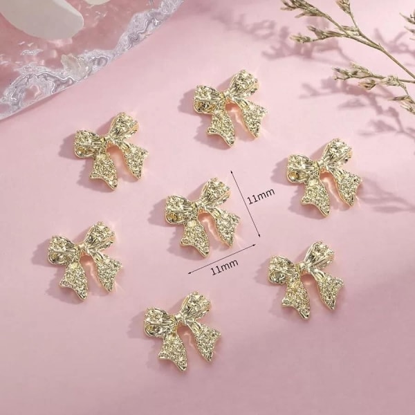 10 st guld bågnitar 3D legering nagelkonst charm söta bågknutar glänsande nageldekorationer plätering charm för naglar guld N