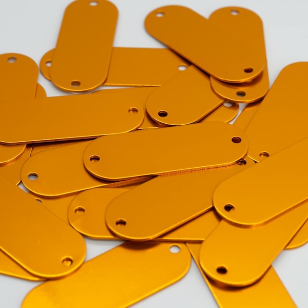Förpackning med 25 tomma aluminiumbrickor med 2 hål (orange)
